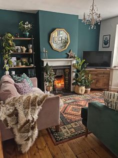 a living room filled with furniture and a fire place next to a fireplace covered in potted plants