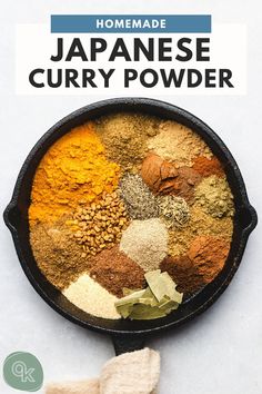 an iron skillet filled with different types of spices and seasonings on top of a white surface