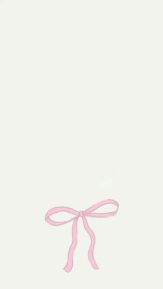 a pink ribbon tied to the side of a white wall