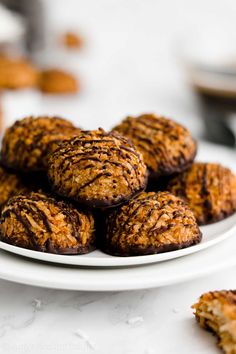 a white plate topped with cookies on top of a table