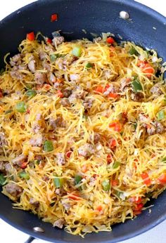 a skillet filled with noodles and meat