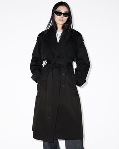 So sophisticated, yet so easy. Meet the Clyde Trench Coat - your go-to for transitional dressing. Made from cotton to an oversized fit, it's a classic trench shape with a little extra - the sleeves can stay on or off. Complete with shoulder epaulettes, a belt and two side pockets. This versatile style adapts from season to season, whatever the occasion.  This coat is designed to an oversized fit, we recommend sizing down for a closer fit Button closure Long sleeve Collar Detachable sleeves Storm Chic Allsaints Winter Outerwear, Allsaints Cotton Outerwear For Fall, Allsaints Black Outerwear For Work, Allsaints Spring Workwear Outerwear, Allsaints Spring Outerwear For Work, Collar Detachable, White Trench Coat, Shoulder Epaulettes, Transitional Dressing