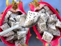 a dragon fruit is cut in half with a spoon