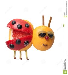 an orange and a ladybug with sunglasses on it's faces are hanging from strings