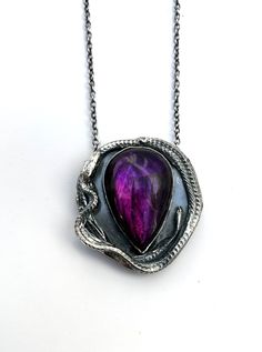 When people see my purple hair I get alot of, "purple is my favorite color too" and it's because it's so healing and calming to look at.
Like this purple dyed labradorite.  I'm OBESSESED WITH her.  Isn't she stunning? And she needs a home, so go snag her before she's gone.  
https://www.eilisainjewelry.com/medea/purplelabradoritependant Mystical Handmade Jewelry For Fantasy Events, Unique Handmade Necklaces For Fantasy Events, Mystical Purple Necklaces With Natural Stones, Necklace Chart, Gothic Amethyst Necklace Gift, Spiritual Purple Pendant Necklace, Mystical Purple Pendant Necklace, Gothic Amethyst Necklace, Purple Dye