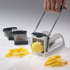 a person is using a slicer to cut fruit