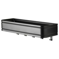 a black plastic planter with wheels on the sides and bottom, is shown in front of a white background