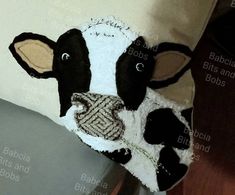 there is a pillow with a cow on it