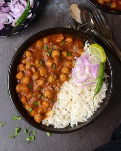 a plate with rice, beans and onions on it