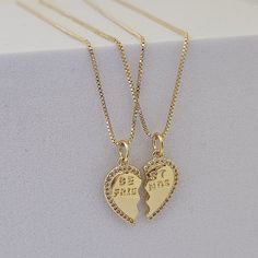 18k Gold Filled Friendship Necklace Best Friend Gifts  Duo Set Heart Necklace BFF Gifts for Her Best Friend Jewelry Heart Couples Necklace  Our enchanting heart necklace is a sign of the unbreakable connection between two soul mates who share a special friendship. Made with love and care, this beautiful necklace is the symbol of everlasting friendship and the unique connection you and your best friend share. Description Heart : Double Half Heart Charms 21MM x 8MM Material: 18k gold filled / Stai Gold Heart Charm Necklace For Best Friend, Heart-shaped Gold Necklace For Best Friend, Gold Heart Necklace For Best Friend, Gold Heart Pendant Jewelry For Best Friend, Gold Heart Pendant Necklace For Best Friend, Gold Heart Charm Jewelry For Best Friend Gift, Gold Charm Necklaces For Valentine's Day And Friendship, Gold Heart Necklace For Best Friend Gift, Gold Necklaces For Best Friend Gift On Mother's Day