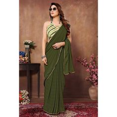 Green colored saree is made from georgette fabric which is highlighted with weaving checks & lace border work as shown with pleats are stitched and size adjusted belt. comes along with printed banglori silk blouse which you can customise as per your design/style. Occasion - You can wear this saree for parties, functions and events. Note:- the actual product may differ slightly in color and design from the one illustrated in the images when compared with computer or mobile screen. Measurements: S Mobile Screen, Georgette Saree, Georgette Fabric, Lace Border, Georgette Sarees, Design Style, Silk Blouse, Checks, Ready To Wear