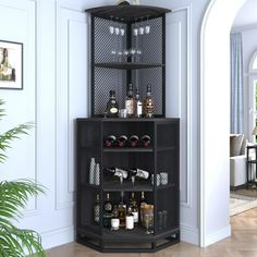 a corner shelf with bottles and glasses on it next to a potted plant in a living room