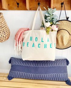 "The HOLA BEACHES Over sized canvas tote bag is perfect for a trip to the beach! Also perfect to use as a reusable shopping bag, or everyday carryall. Available with text in several colors... check out the variations! This bag is made from 100% thick, sturdy canvas. AVAILABLE IN TWO SIZES * Large - 19.5\" x 13\" with a 4\" gusset *Jumbo - 23\" x 13\" with a 6\" gusset These bags are hand painted using non-toxic fabric paint. The technique used creates an attractive distressed appearance to the t Hola Beaches, Summer Style Beach, Girls Beach Trip, Large Beach Bag, Burlap Tote Bags, Large Beach Bags, Burlap Tote, Gift Totes, Summer Fashion Beach