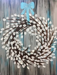 a painting of a wreath with blue bow on it