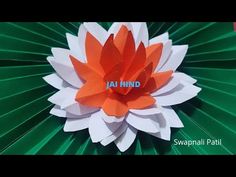 an orange and white paper flower with the word jai hindd written on it