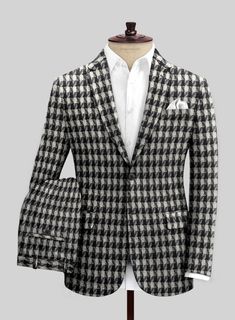 Unveil our Highlander BW Bold Box Tweed Suit - a marvel piece for the trailblazing tastemaker. Meticulously tailored from pure wool, this sumptuous tweed fabric delivers both coziness and refinement while flaunting a captivating black-and-white plaid motif. The design marries timeless grace with a fresh, modern twist, making it the go-to choice for those aiming to leave an indelible mark at any occasion. Whether it’s a strategic boardroom session or an upscale gathering, this suit has got you covered.

Look Includes

Highlander BW Bold Box Tweed Fabric
Two Button Jacket Style
Notch Lapel
Horn Royal Black Buttons
Single Vent
Three Cuff Buttons
Two Welted Back Pockets on Trousers Tweed Suit, Tweed Suits, Button Jacket, Tweed Fabric, Wool Suit, Suit Shop, Italian Fabric, Double Breasted Suit, Jacket Buttons