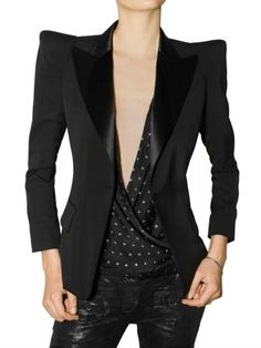 Black wool tailored jacket by Balmain featuring angular peaked shoulders. The jacket has a satin collar with wide lapels and a one-button front closure. It has two flap-top front pockets and four-button details on the cuffs. Pointed Shoulder, Black Tuxedo Jacket, Balmain Jacket, Balmain Blazer, Tuxedo Women, White Tuxedo, Black Tuxedo, Tuxedo Jacket, Leather Jackets Women