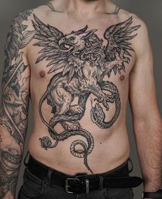 a man with a dragon tattoo on his chest