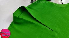 the green fabric is being sewn together to make a dress with dots on it