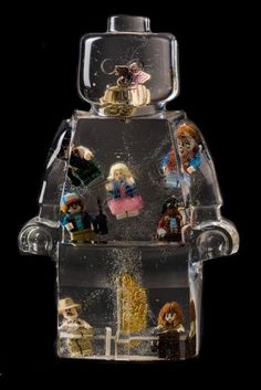 a glass figurine with many different things in it