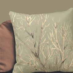 a pillow that has some branches on it