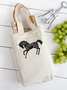 a wine bottle and corkscrew next to a bag with a horse on it