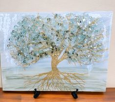 a glass painting with a tree on it