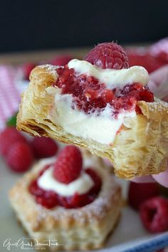 raspberry cream filled pastries on a plate