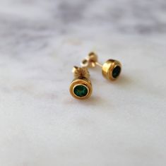 A T T R I B U T E S Vintage ∙ Genuine Gemstones ∙ Real Gold ∙ Estate Jewelry D E T A I L S ~ Vintage Stud Earrings ~ Emerald Studs  ~ Set in solid 14K Gold ~ Natural Emeralds  ~ Yellow Gold *Natural gemstones may include inclusions which might not be visible in photos S P E C S ~ Closure: Pushback (backings are not identical *see photos) ~ Shape: Round ~ Setting: Bezel ~ Total Weight: 3.5g ❤️ IS ∙ T H I S ∙ A ∙ G I F T ? ❤️ All items are elegantly packaged like gifts - whether they're for you or Minimalist Yellow Gold Earrings For May Birthstone, Minimalist Yellow Gold May Birthstone Earrings, Yellow Gold Bezel Setting Earrings For May Birthstone, Emerald Studs, Photo Shape, Vintage Stud Earrings, Earrings Emerald, May Birthstone, Stud Set