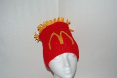 a crocheted mcdonald's hat on a mannequin headdress