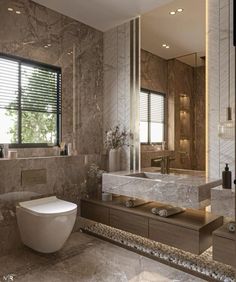 a modern bathroom with marble walls and flooring