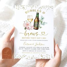 a person holding up a card with a beer and flowers on it that says bubbles and brews