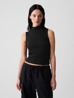 Soft knit stretch cotton and modal tank top.  Mockneck.  Sleeveless.  Straight silhouette with a slim fit.  Hits at the hip.  Models wearing Gap