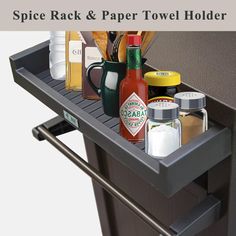 spice rack and paper towel holder on top of a trash can with spices in it