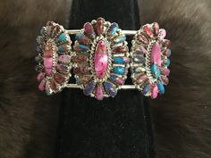 SIGNED Beautiful Zuni Sterling Silver Pink Dalia Petit Point Bracelet Cuff Native American Zuni Tribe Sterling Silver Pink Dalia Bracelet Cuff.  The length is approximately 7.0" including 1.0" opening. Width of Turquoise is 1.5 inches. These are Inlaid with RARE Pink Dalia Petit Points with Cuff having many Inlaid Petit Points. Absolutely Amazing.. and perfect for Pink Dalia Collectors. ~ Zuni Petit point Jewelry began around 1920-1930 and was a unique form of Turquoise Jewelry created by the Zu Handmade Southwestern Cuff Bracelet, Southwestern Multicolor Adjustable Cuff Bracelet, Adjustable Multicolor Southwestern Cuff Bracelet, Southwestern Style Multicolor Bracelet Jewelry, Southwestern Style Multicolor Bracelet, Southwestern Multicolor Cuff Bangle, Southwestern Style Multicolor Bangle Jewelry, Adjustable Multicolor Western Jewelry, Pink Dalia