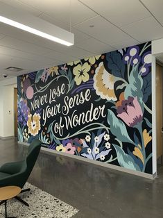 an office with a mural on the wall that says, you lose your sense of wonder