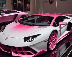 two pink and white lamb cars on display