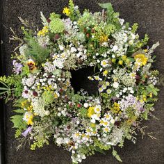 a wreath made out of flowers on the ground