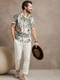 At once rugged and soft, this resort shirt is ideal for travel thanks to a luxurious, breathable cotton fabric and a camp collar for at-ease style.  Camp collar.  Button front.  Straight hem.  Unlined.  Standard fit.  Short sleeves.  Hip length.  Bod Formal Hawaiian Outfit For Men, Resort Dinner Outfit Men, Tommy Bahama Menswear, Mens Havana Nights Outfit, Mens Smart Casual Summer Outfits, Tropical Attire Men, Island Cocktail Attire Men, Summer Cocktail Outfit Men, Men Tropical Vacation Outfits