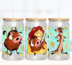 three glass jars with cartoon characters painted on them