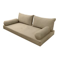 a beige couch with pillows on it