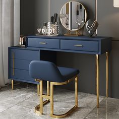 a blue and gold desk with a mirror on the wall next to an arm chair