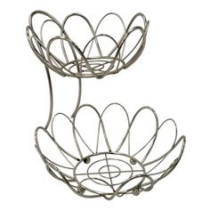 two metal flower baskets sitting on top of each other