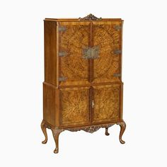 an antique wooden cabinet with two doors