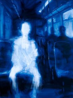 a blurry image of a person sitting on a bus