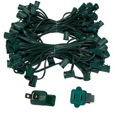 a bunch of green christmas lights with no red circle on the bottom and black wires attached to each other