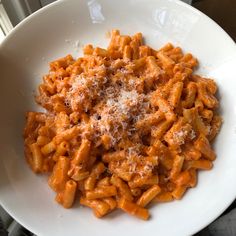 a white bowl filled with macaroni and cheese