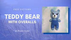 a crocheted teddy bear with overalls is shown in front of a blue background