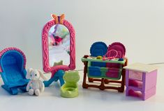 there is a doll house set with furniture and toys in the room on the floor