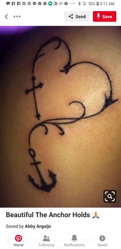 an anchor and heart tattoo on the back of a woman's thigh, with black ink